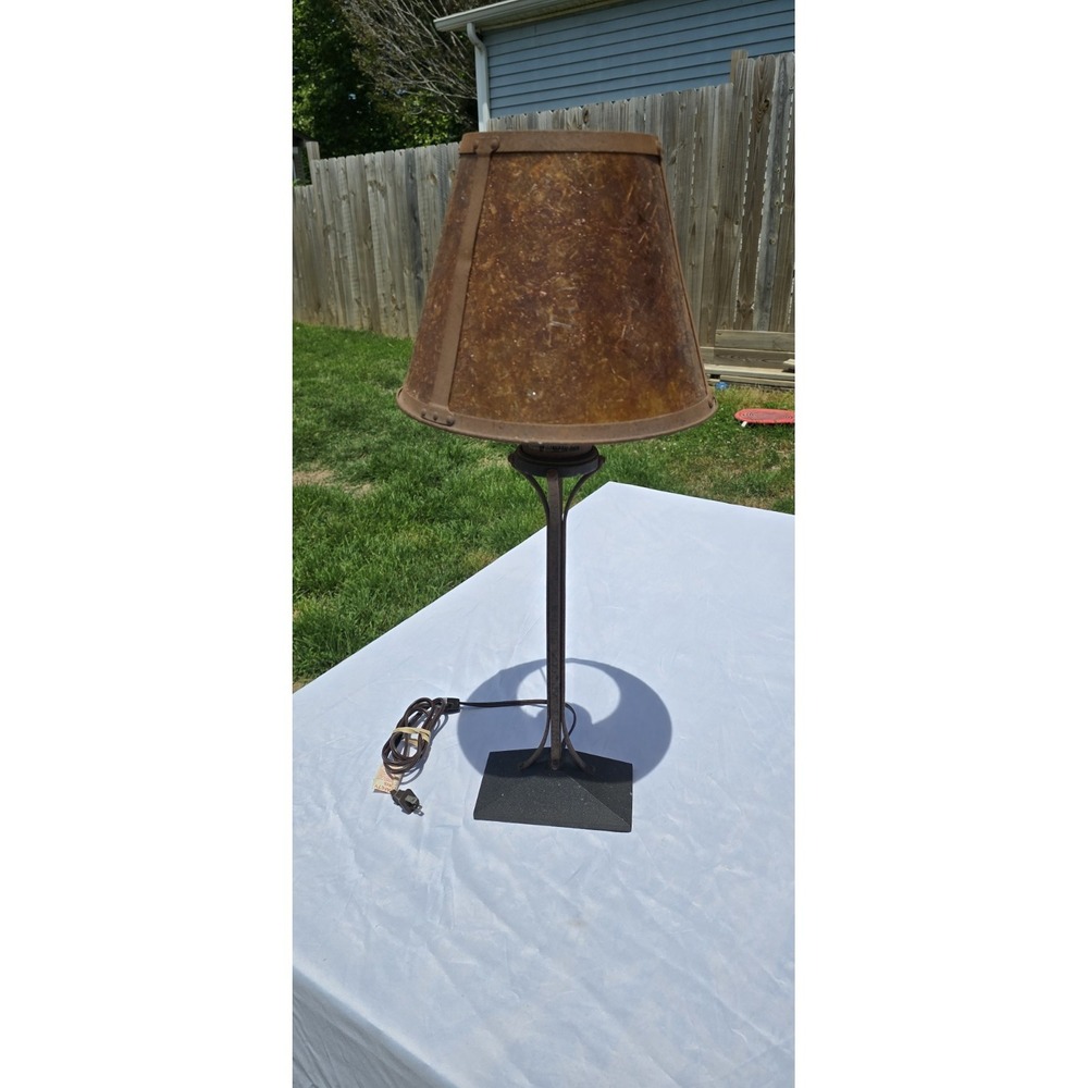 vintage-style table lamp W/ a amber mica shade supported by a wrought iron frame